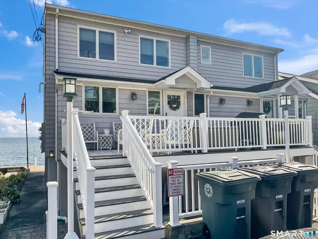 a view of roof house with wooden deck
