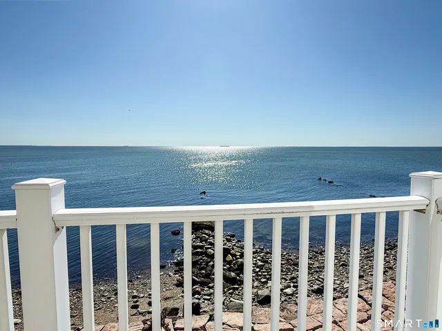a view of balcony with wooden floor