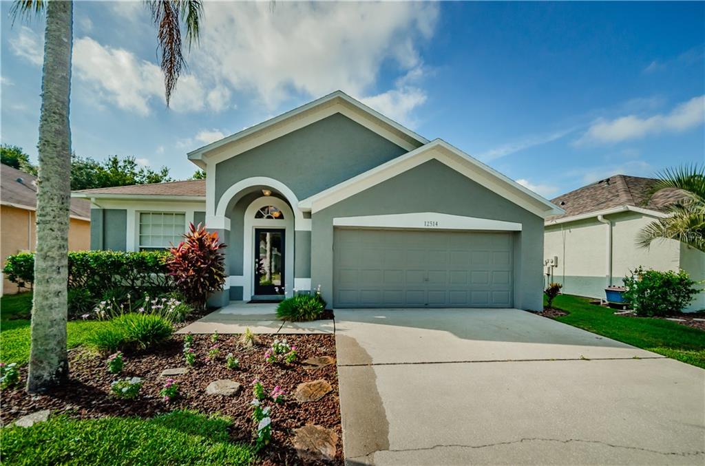 12514 Sparkleberry Road Tampa, FL 33626 - Photo 1 of 1 a front view of a house with garden