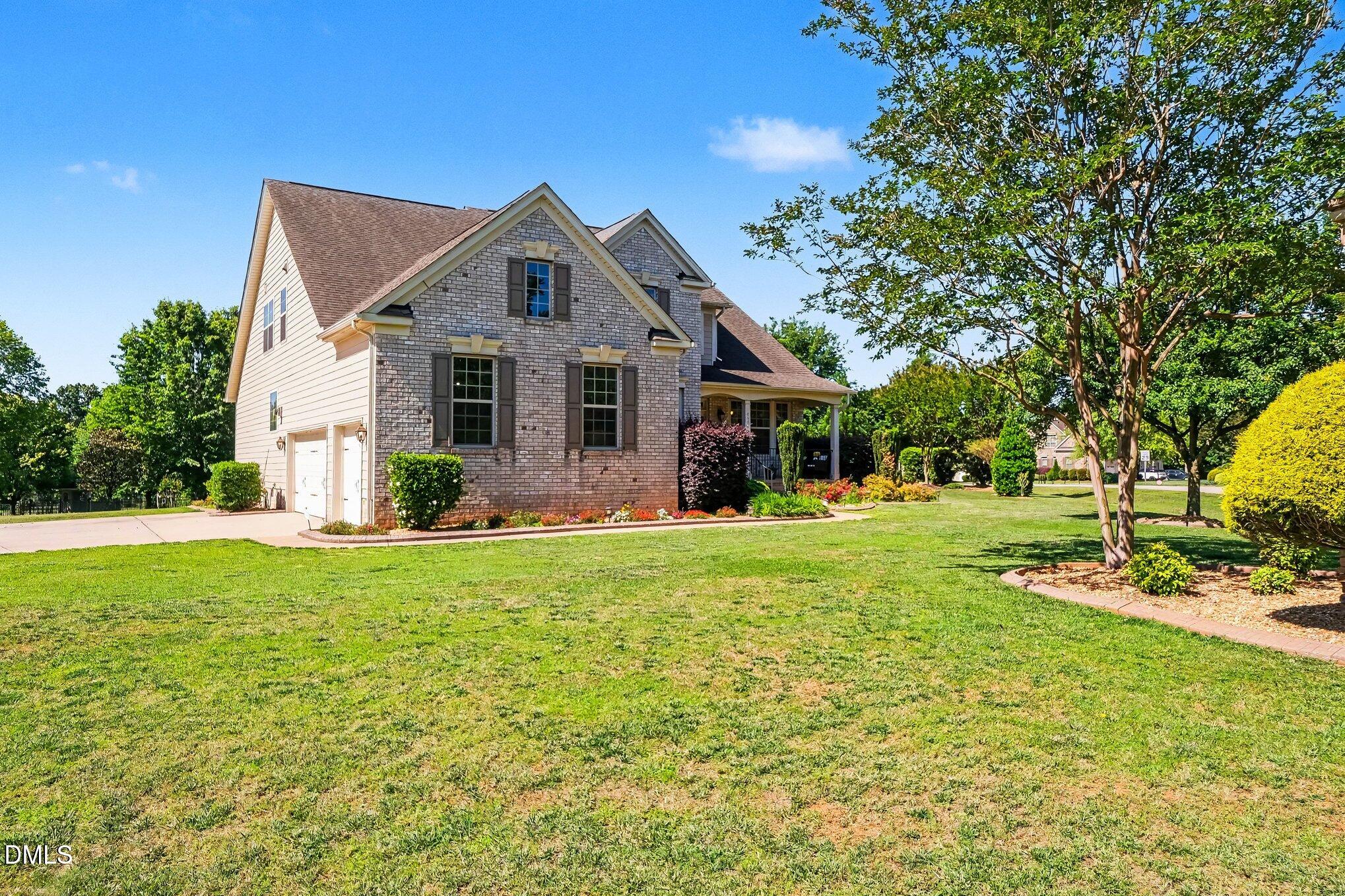 4000 Banks Stone Drive Raleigh, NC 27603 - Photo 56 of 60 a front view of house with yard and green space
