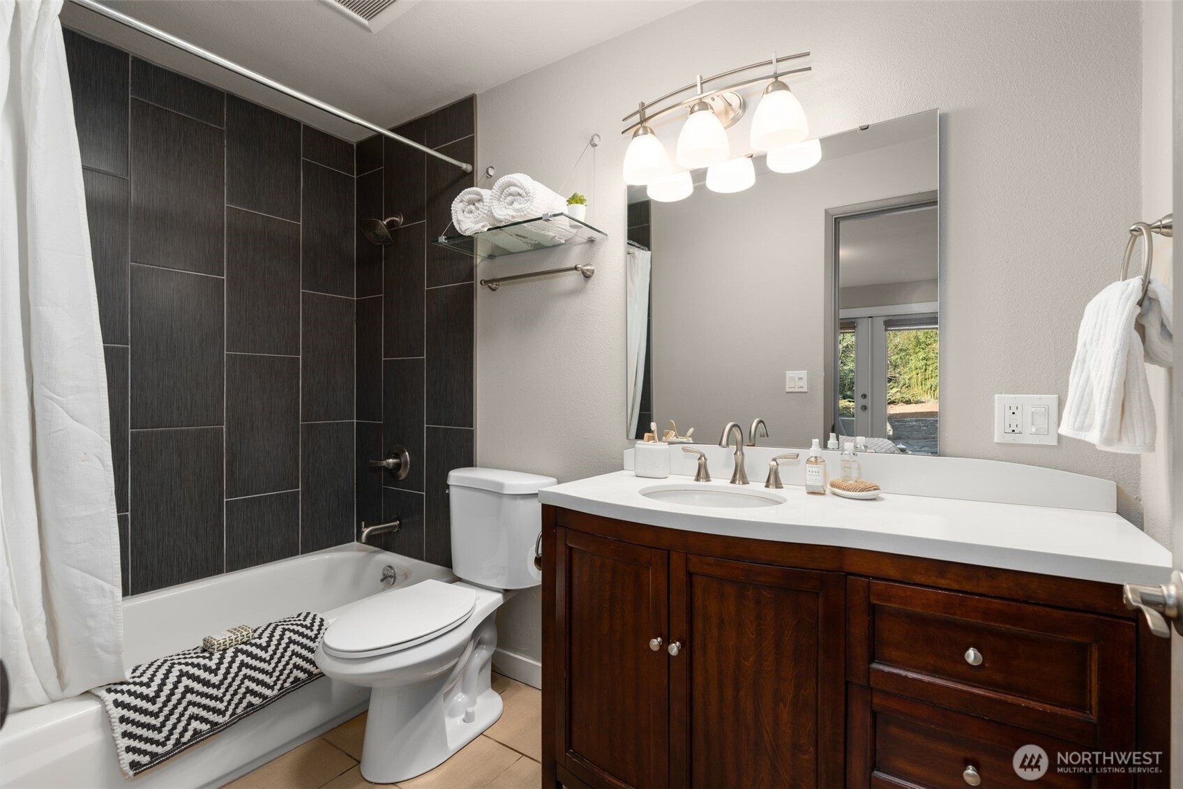 6528 23rd Avenue Southwest Seattle, WA 98106 - Photo 14 of 39 a bathroom with a sink vanity mirror and toilet