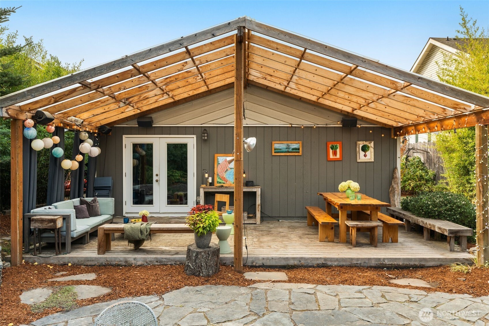 6528 23rd Avenue Southwest Seattle, WA 98106 - Photo 23 of 39 a view of a patio with table and chairs under an umbrella