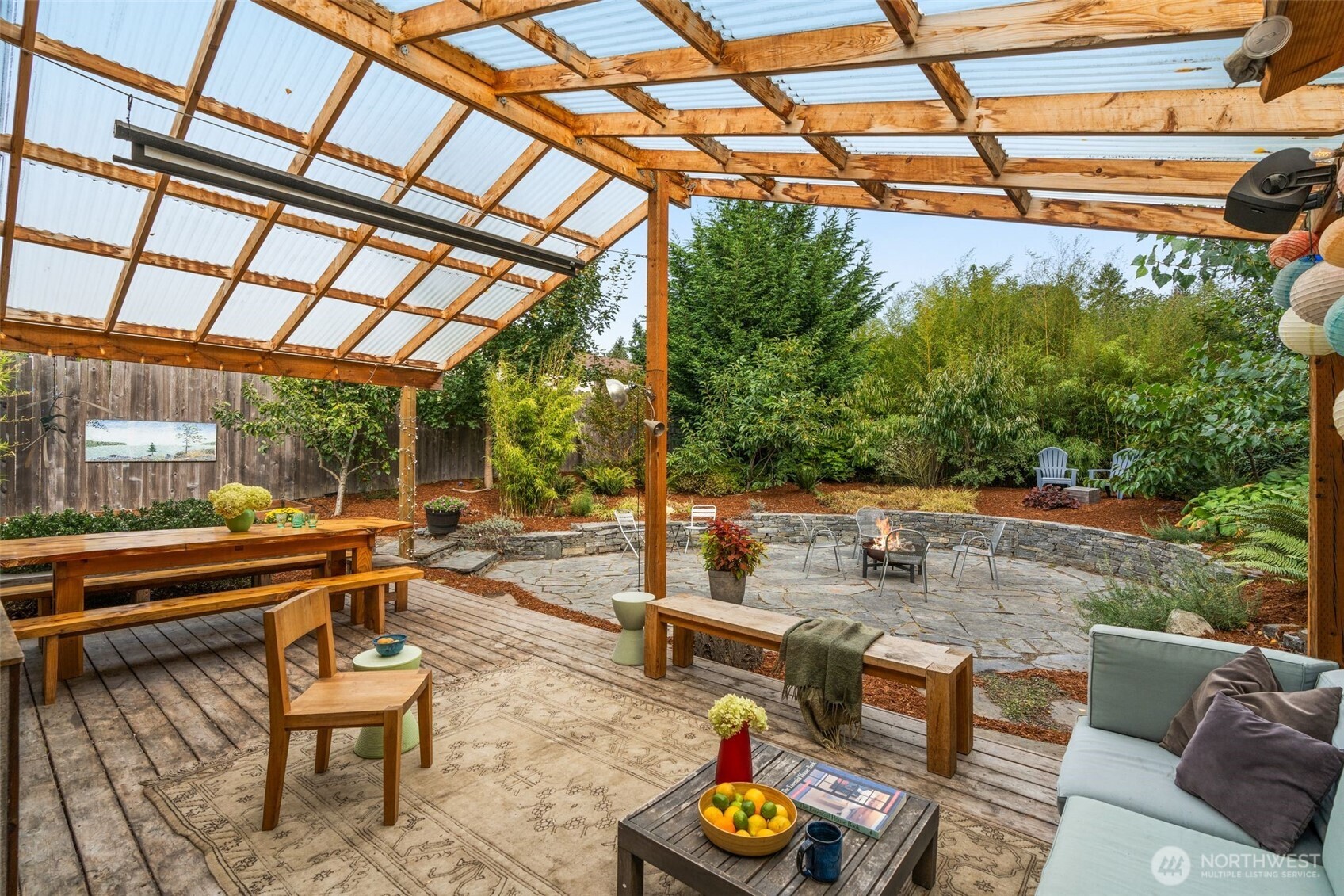 6528 23rd Avenue Southwest Seattle, WA 98106 - Photo 27 of 39 a backyard of a house with garden and outdoor seating