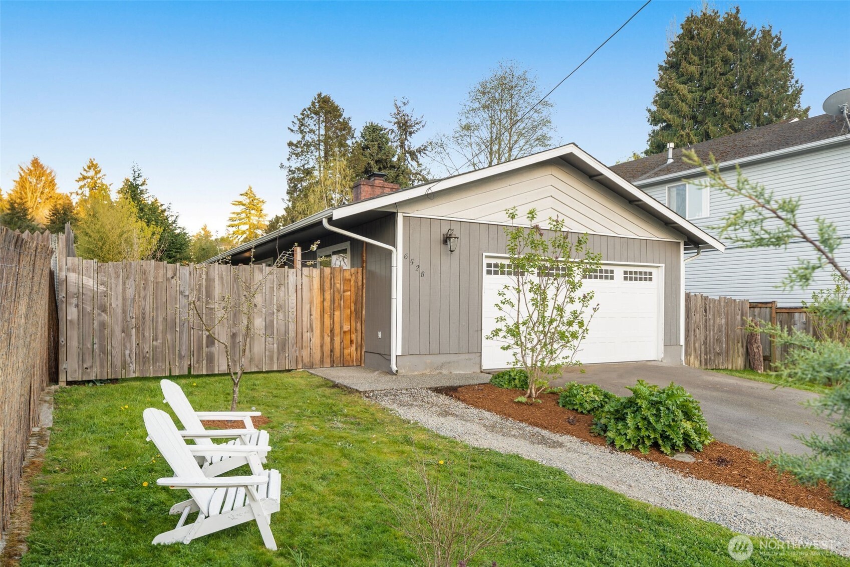 6528 23rd Avenue Southwest Seattle, WA 98106 - Photo 37 of 39 a front view of a house with garden
