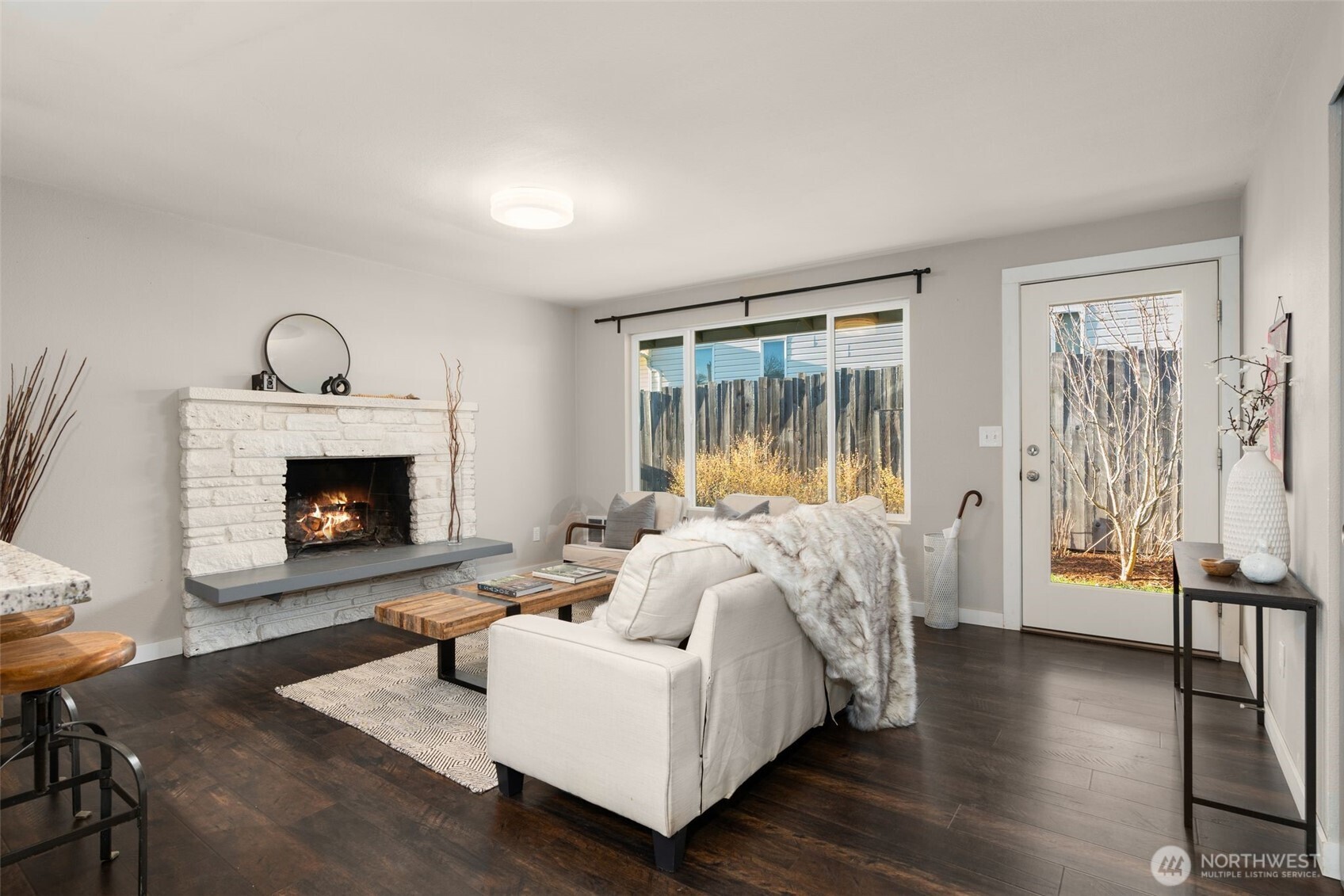 6528 23rd Avenue Southwest Seattle, WA 98106 - Photo 4 of 39 a living room with furniture and a fireplace