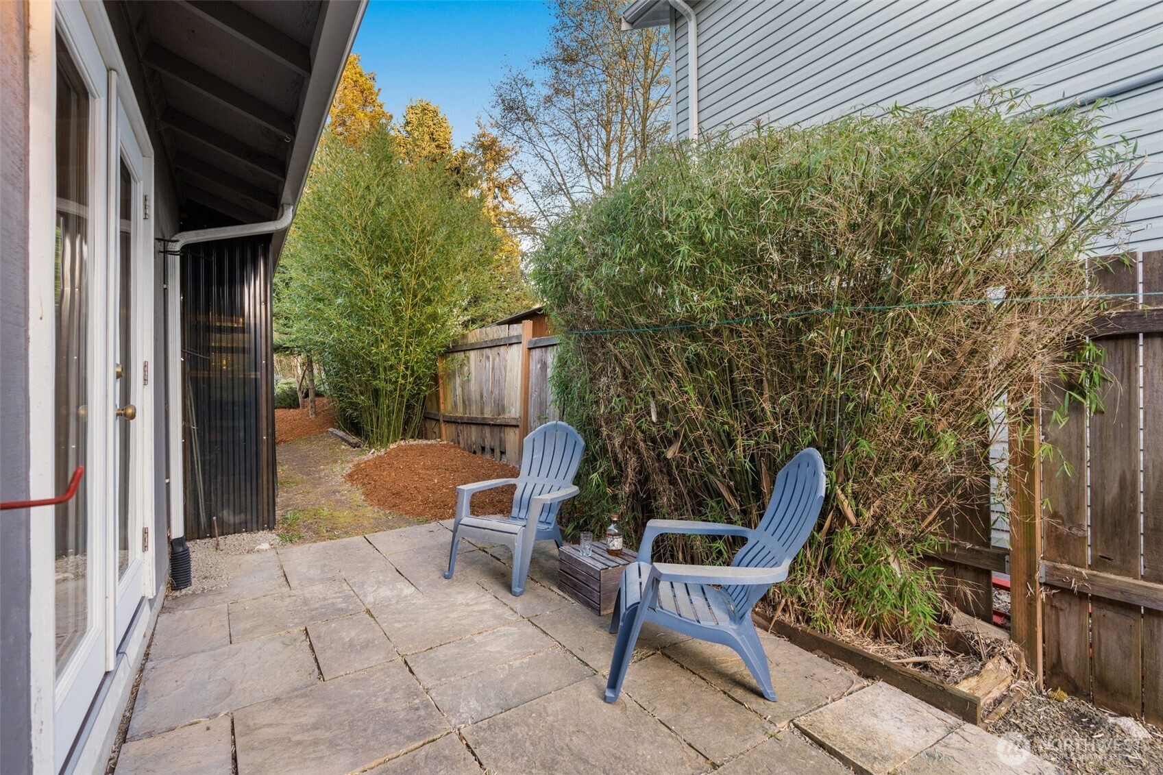 6528 23rd Avenue Southwest Seattle, WA 98106 - Photo 8 of 39 a view of backyard with seating space and wooden fence