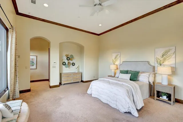 a bedroom with a bed and a couch