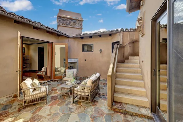 a outdoor space with lots of chairs and a wooden floor