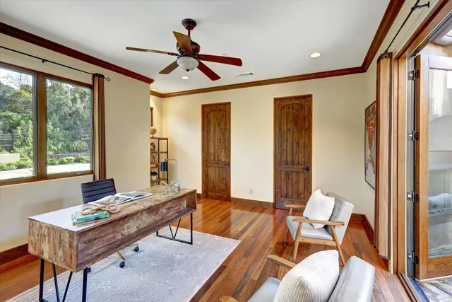 a living room with furniture a table and a large window