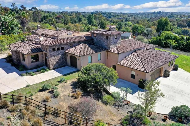 an aerial view of a house with a garden