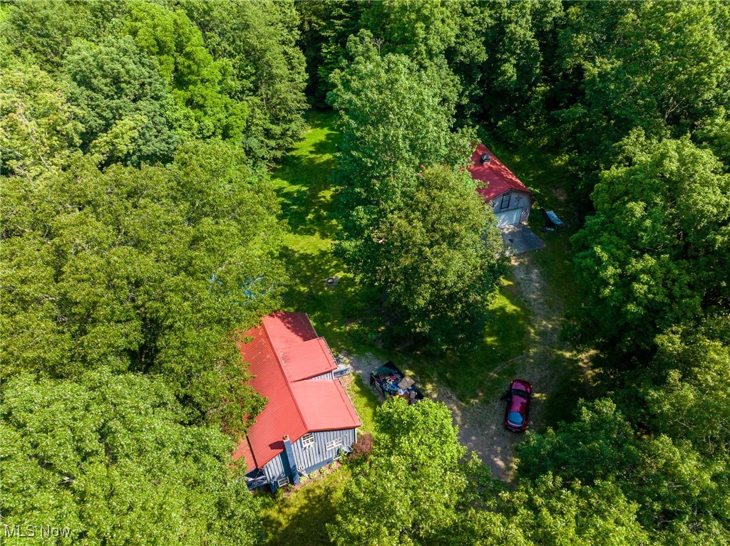 9177 Derry Road Southwest Bowerston, OH 44695 - Photo 9 of 26 Aerial view of property and surrounding area with a forest