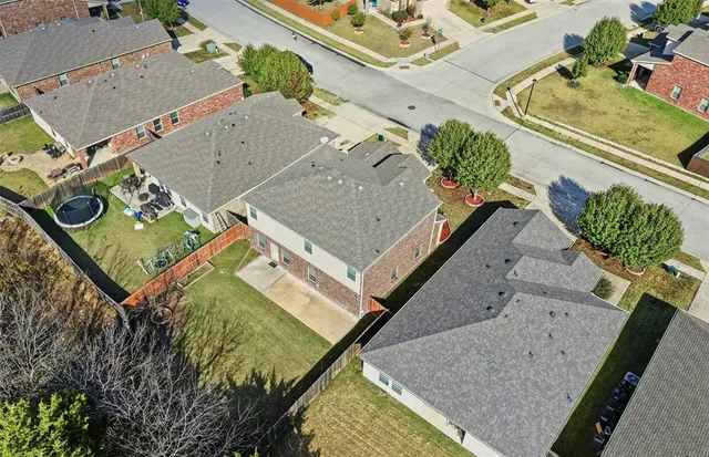 a view of backyard with wooden fence