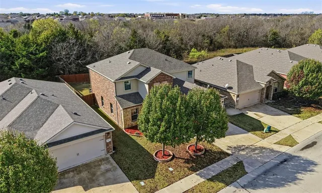an aerial view of a house with garden space