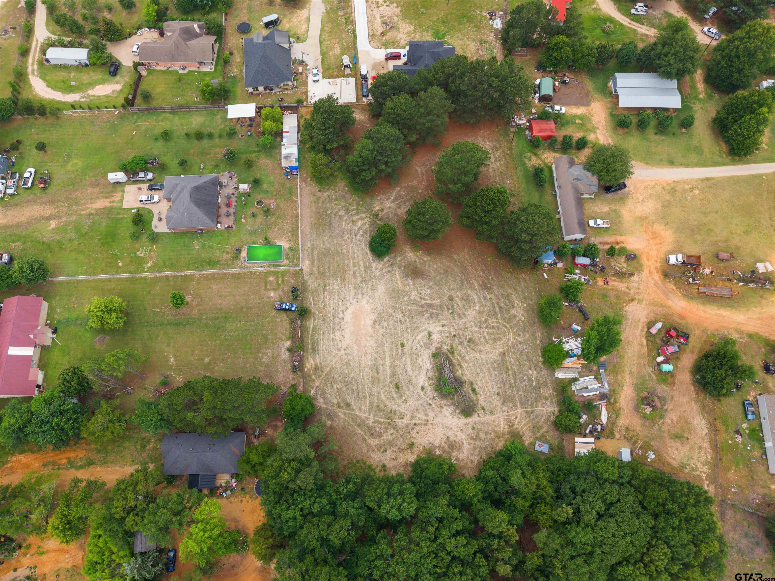 2425 Thompson Lane Tyler, TX 75704 - Photo 24 of 27 an aerial view of residential house with outdoor space and parking