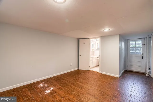 a view of an empty room and window