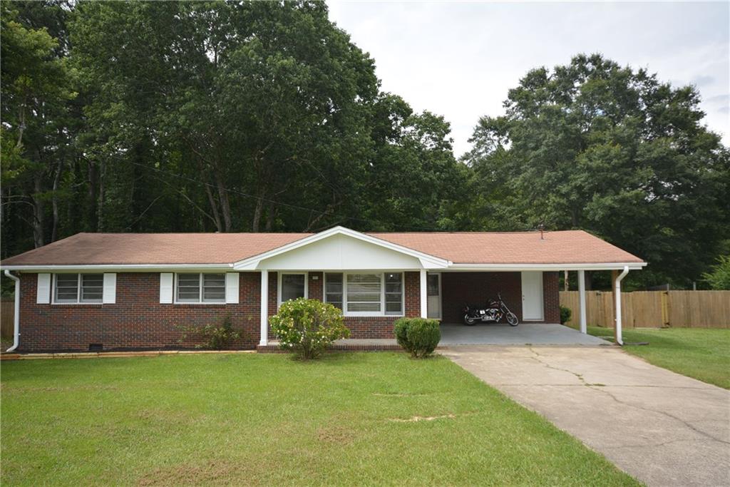5528 Angham Road Powder Springs, GA 30127 - Photo 1 of 1 a front view of a house with a yard