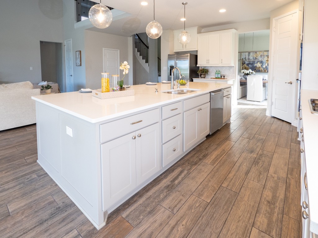 2001 Limestone Lake Drive Georgetown, TX 78633 - Photo 11 of 40 a large kitchen with a lot of counter space and wooden floor