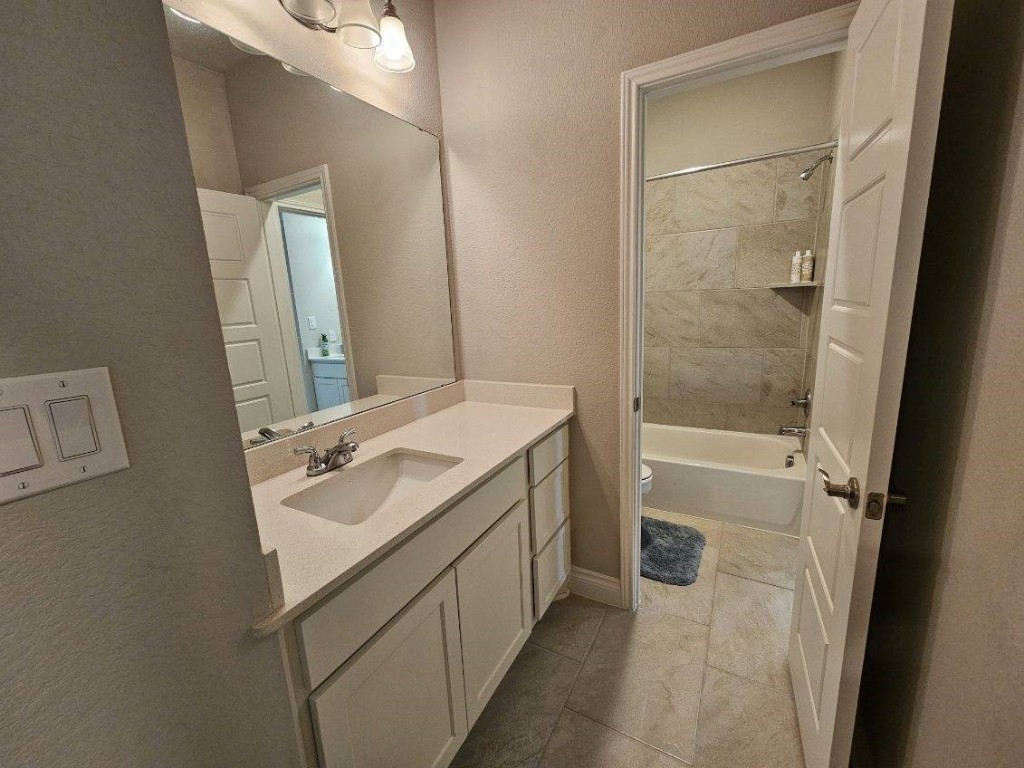 2001 Limestone Lake Drive Georgetown, TX 78633 - Photo 31 of 40 a bathroom with a sink a toilet and shower