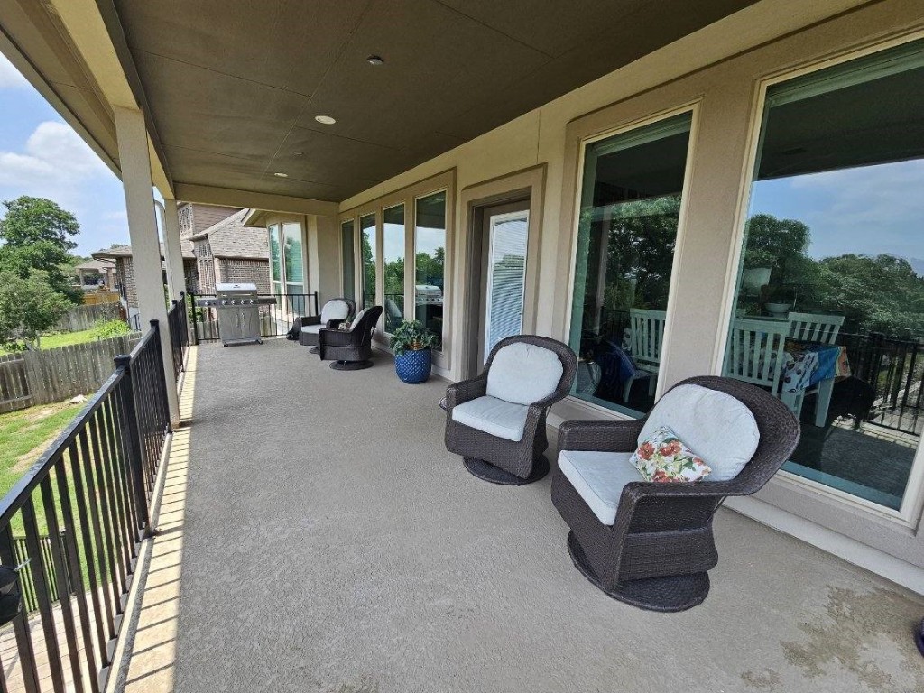 2001 Limestone Lake Drive Georgetown, TX 78633 - Photo 32 of 40 a view of a patio with couches table and chairs and potted plants
