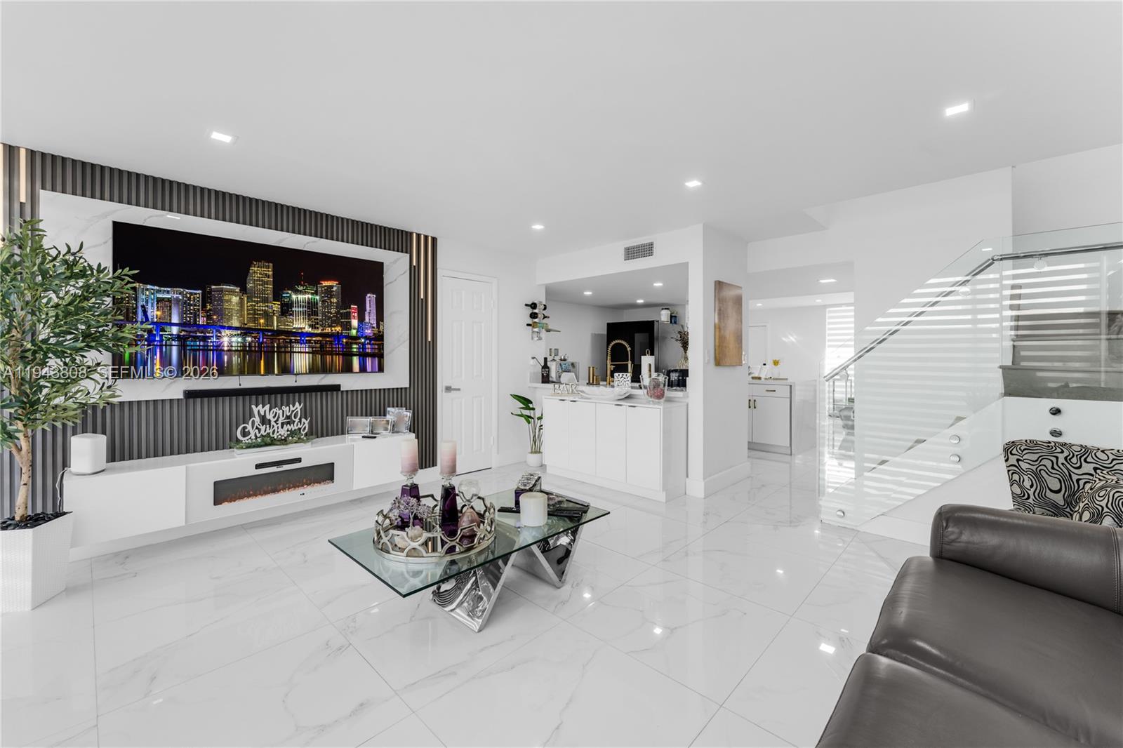 a living room with furniture and a book shelf