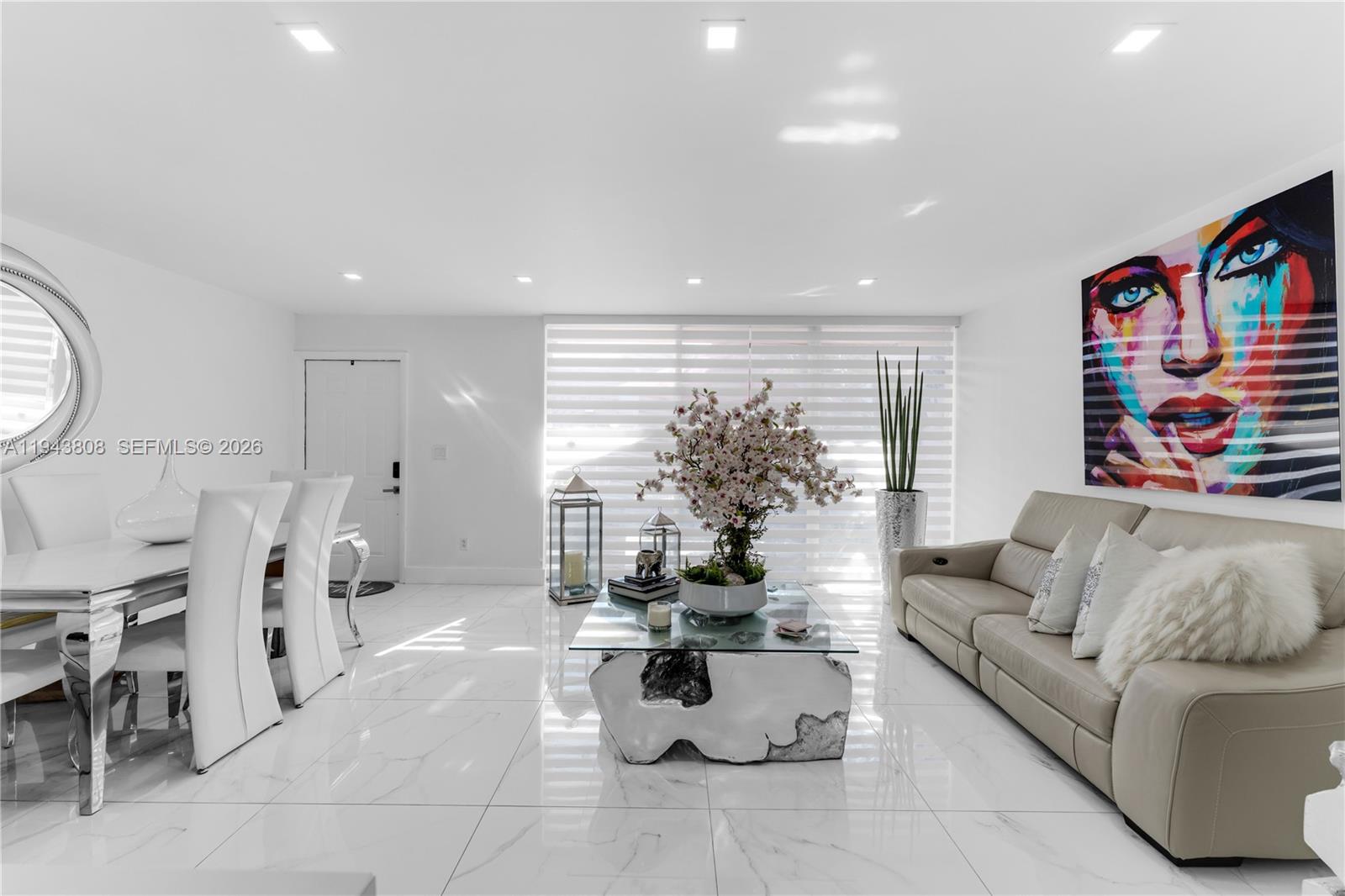 13835 Southwest 84th Street, Unit 503 Miami, FL 33183 - Photo 12 of 32 a living room with furniture and a large window
