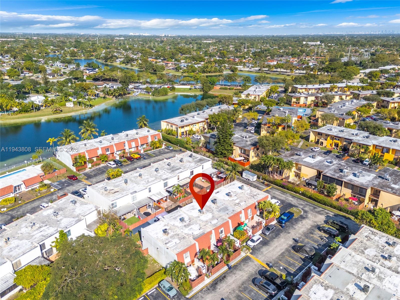 13835 Southwest 84th Street, Unit 503 Miami, FL 33183 - Photo 27 of 32 an aerial view of residential building and lake