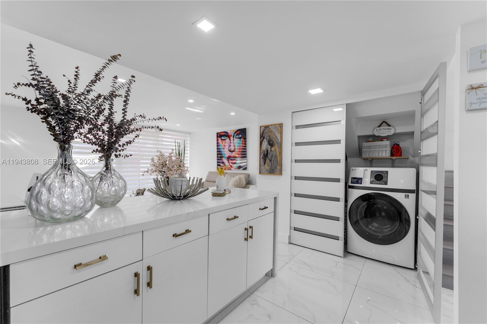 13835 Southwest 84th Street, Unit 503 Miami, FL 33183 - Photo 8 of 32 a kitchen with a refrigerator and cabinets