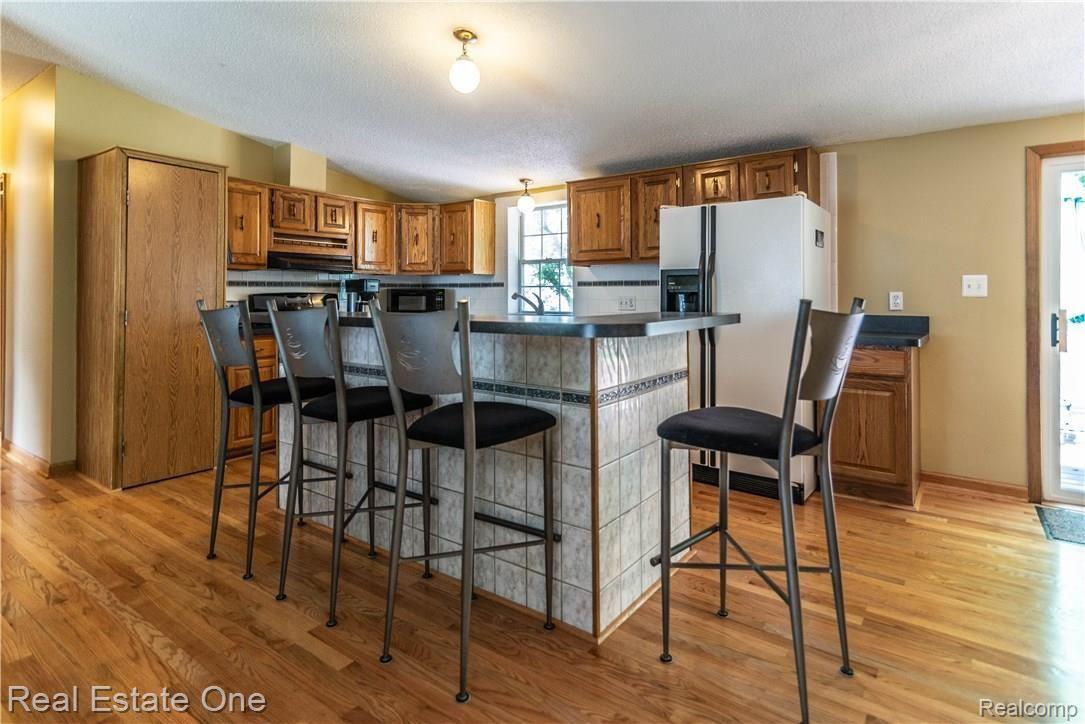 245 Herman Street Novi, MI 48377 - Photo 6 of 28 Over sized island/snack bar