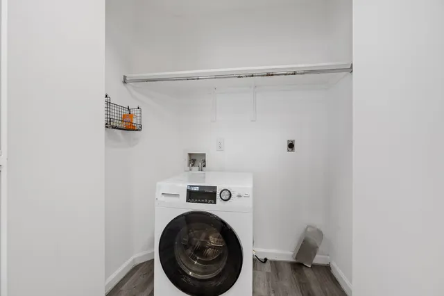 a view of bathroom with washer and dryer
