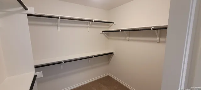 a view of an empty walk in closet