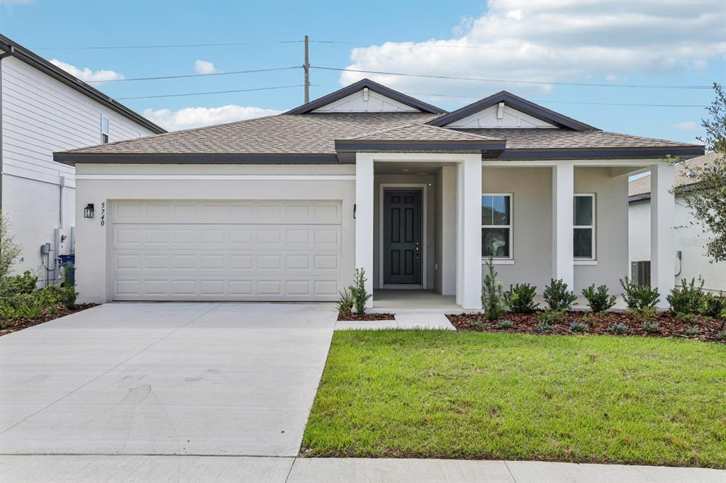 5740 Haystack Drive St. Cloud, FL 34771 - Photo 1 of 39 front view of a house with a yard