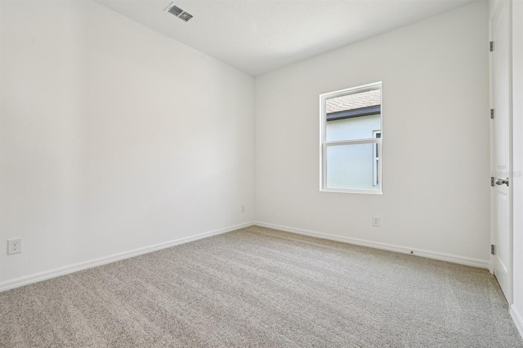 5740 Haystack Drive St. Cloud, FL 34771 - Photo 20 of 39 an empty room with a window