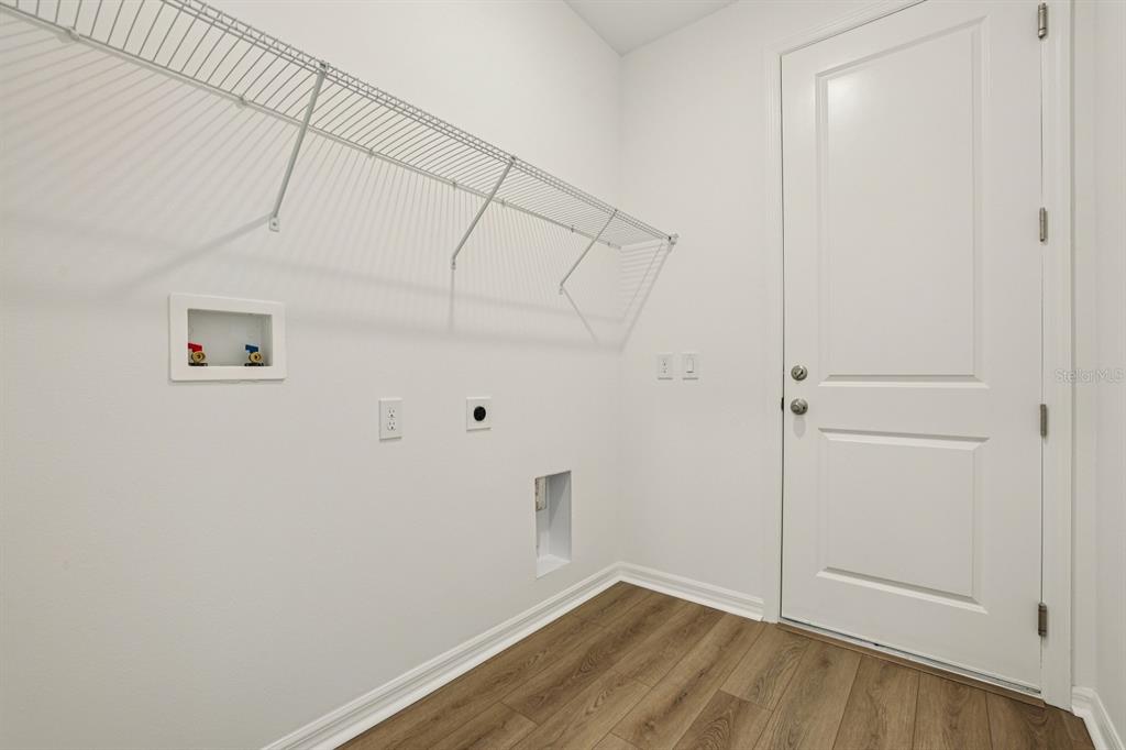 5740 Haystack Drive St. Cloud, FL 34771 - Photo 23 of 39 a view of a room with wooden floor