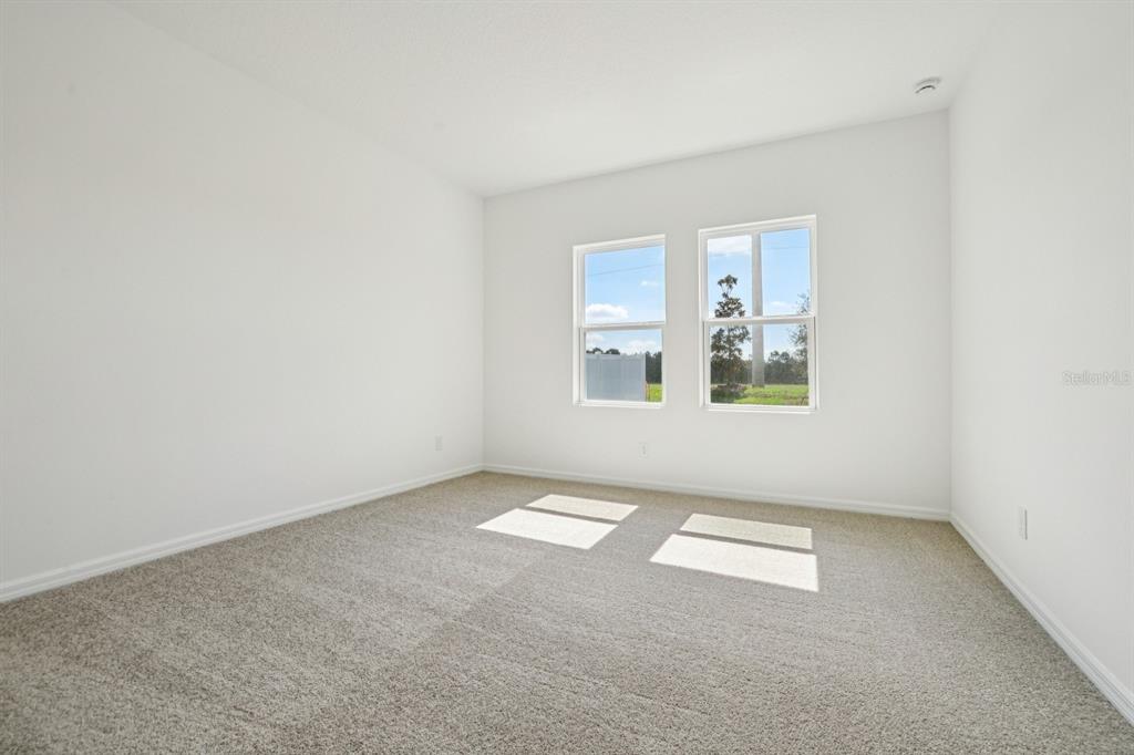 5740 Haystack Drive St. Cloud, FL 34771 - Photo 27 of 39 an empty room with windows