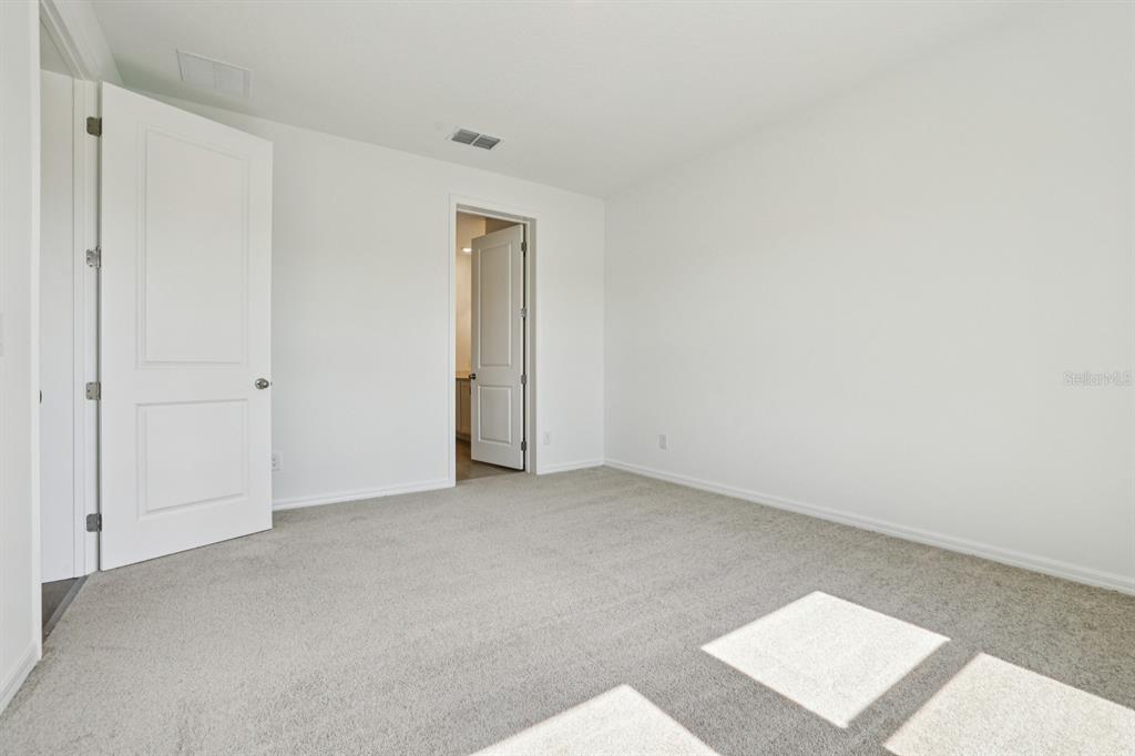 5740 Haystack Drive St. Cloud, FL 34771 - Photo 30 of 39 an empty room with an entryway