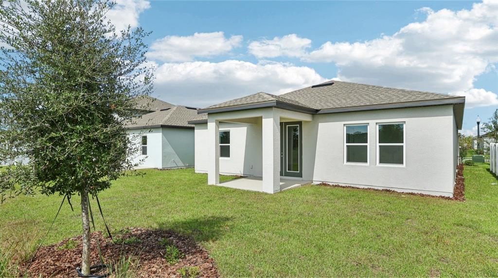 5740 Haystack Drive St. Cloud, FL 34771 - Photo 36 of 39 a view of house with backyard