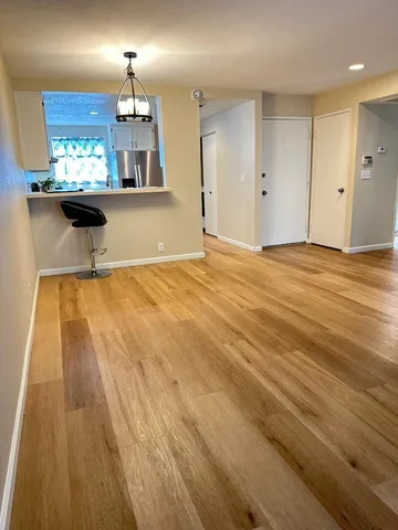 a kitchen with white cabinets and a sink