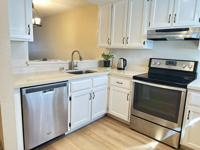 a view of cabinets and wooden floor