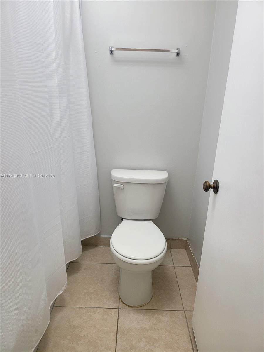 3750 Inverrary Drive, Unit 2Y Lauderhill, FL 33319 - Photo 13 of 44 a white toilet sitting next to a shower