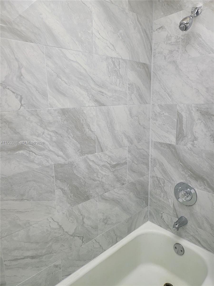 3750 Inverrary Drive, Unit 2Y Lauderhill, FL 33319 - Photo 14 of 44 a bathroom with a bathtub