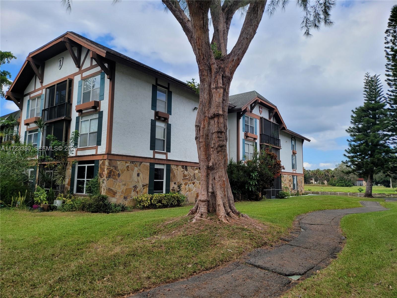 3750 Inverrary Drive, Unit 2Y Lauderhill, FL 33319 - Photo 16 of 44 a front view of a house with garden