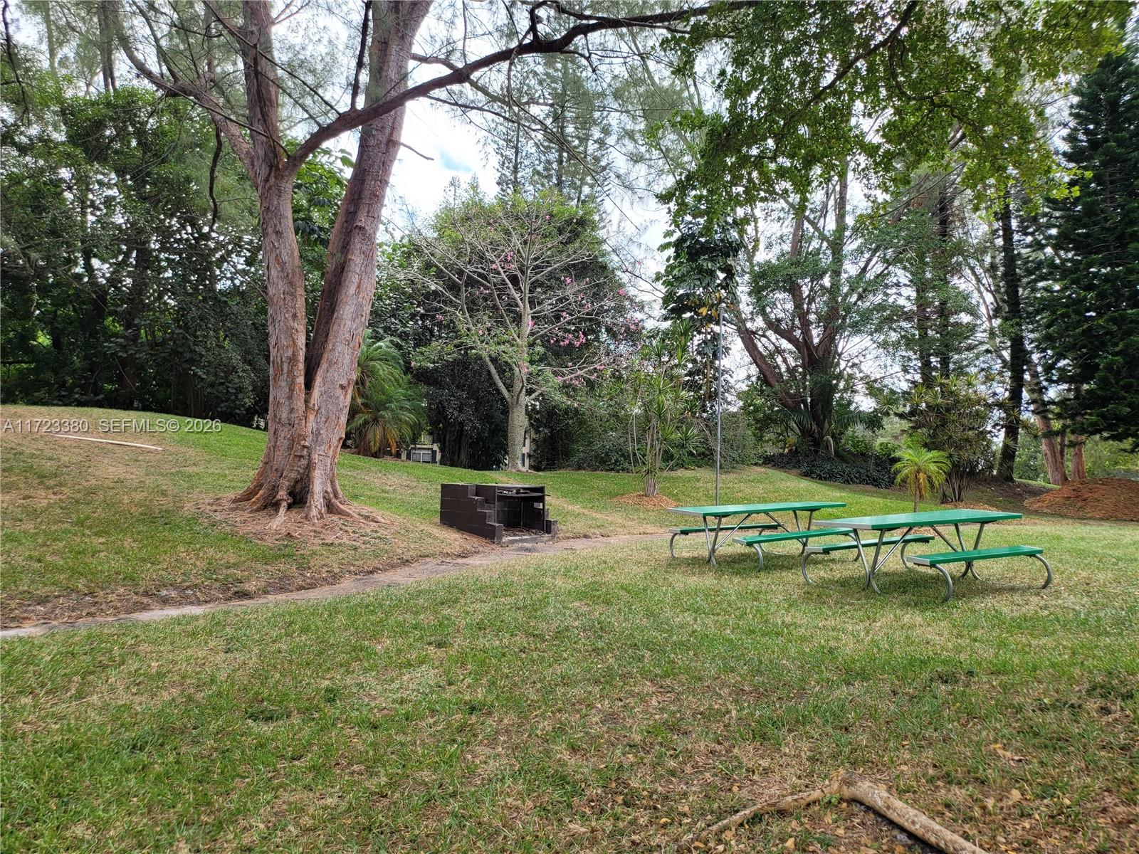 3750 Inverrary Drive, Unit 2Y Lauderhill, FL 33319 - Photo 19 of 44 a view of a park with large trees