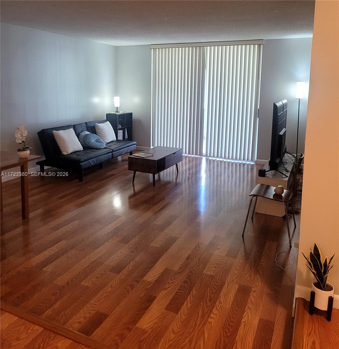 3750 Inverrary Drive, Unit 2Y Lauderhill, FL 33319 - Photo 3 of 44 a living room with furniture and wooden floor