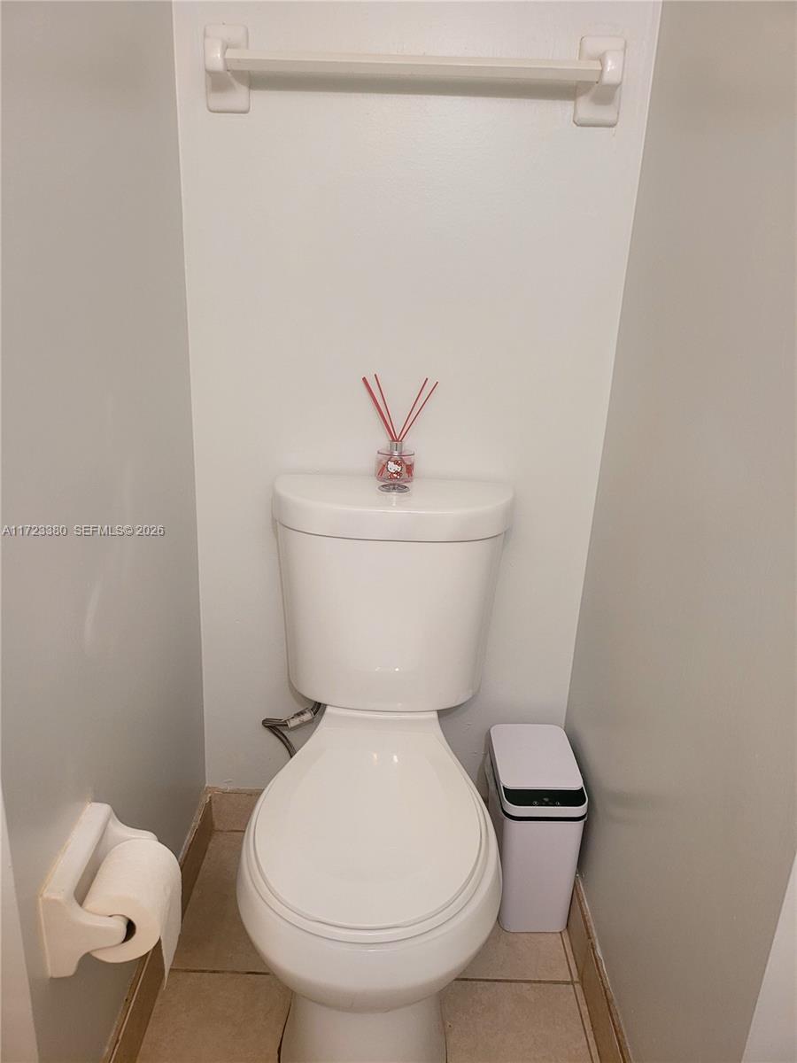 3750 Inverrary Drive, Unit 2Y Lauderhill, FL 33319 - Photo 8 of 44 a white toilet sitting next to a shower