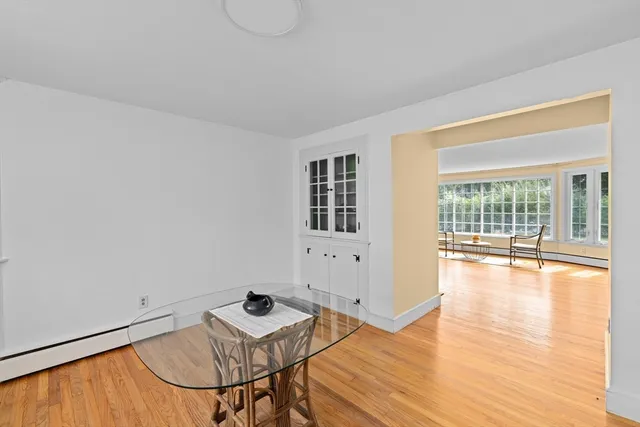 a view of a room with furniture and wooden floor