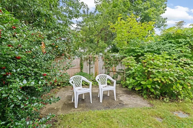 a couple of table and chairs in the garden