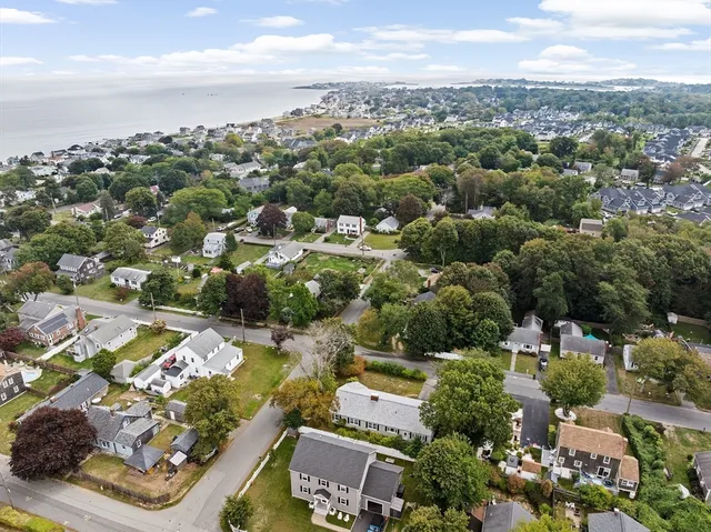 an aerial view of residential houses with outdoor space