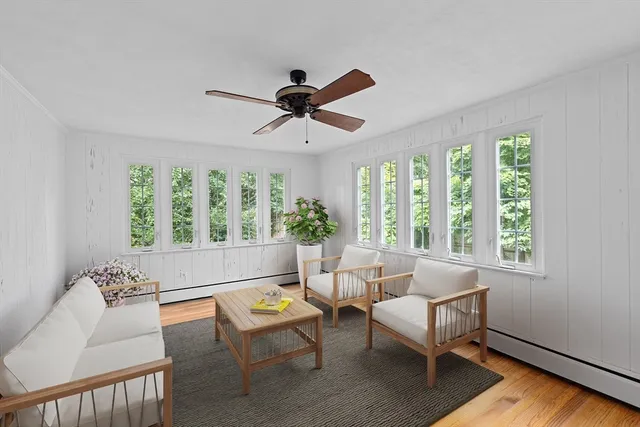 a living room with furniture and a window