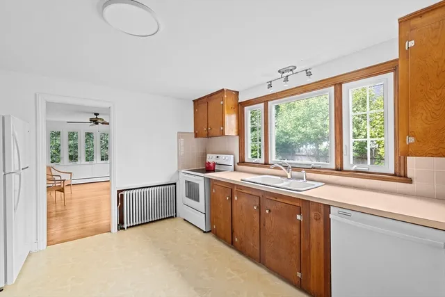 a kitchen with stainless steel appliances a sink and a window