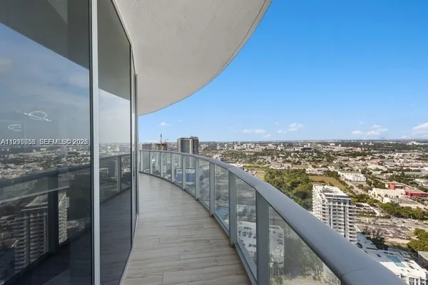 a view of a balcony with city